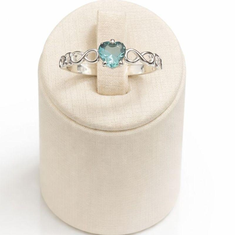 ANEL SOLITÁRIO INFINITO CORAÇÃO C/ ZIRC. 5MM AGUA MARINHA