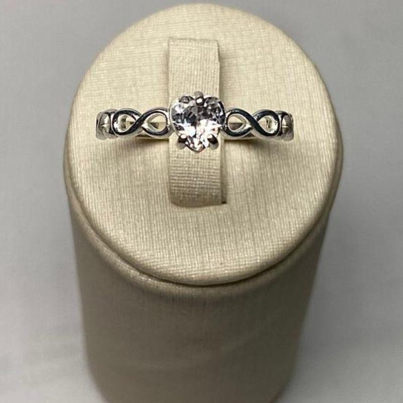 ANEL SOLITÁRIO INFINITO CORAÇÃO C/ ZIRC. 5MM CRISTAL