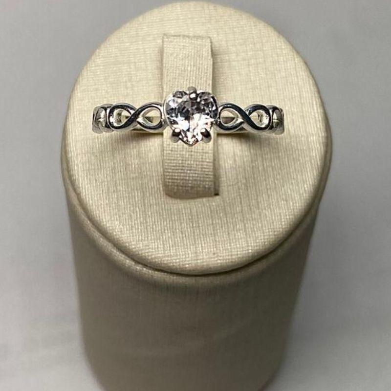 ANEL SOLITÁRIO INFINITO CORAÇÃO C/ ZIRC. 5MM CRISTAL