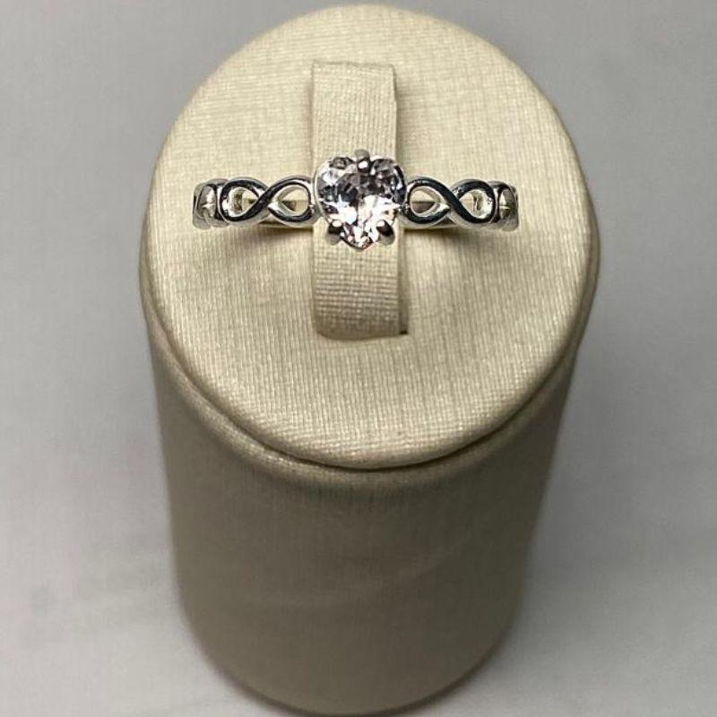 ANEL SOLITÁRIO INFINITO CORAÇÃO C/ ZIRC. 5MM CRISTAL