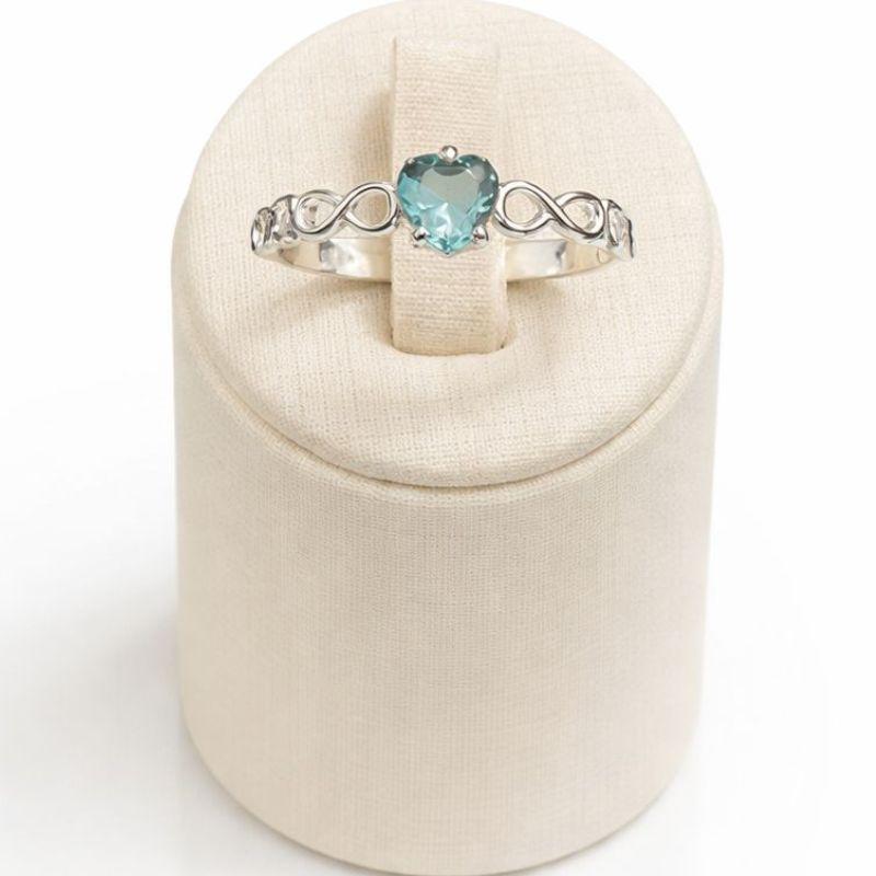 ANEL SOLITÁRIO INFINITO CORAÇÃO C/ ZIRC. 5MM AGUA MARINHA