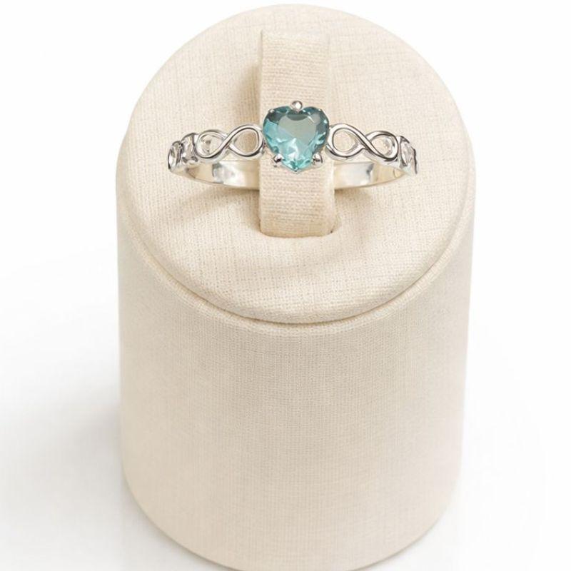 ANEL SOLITÁRIO INFINITO CORAÇÃO C/ ZIRC. 5MM AGUA MARINHA