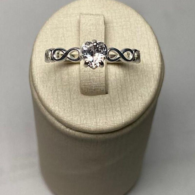 ANEL SOLITÁRIO INFINITO CORAÇÃO C/ ZIRC. 5MM CRISTAL