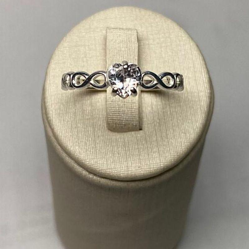 ANEL SOLITÁRIO INFINITO CORAÇÃO C/ ZIRC. 5MM CRISTAL