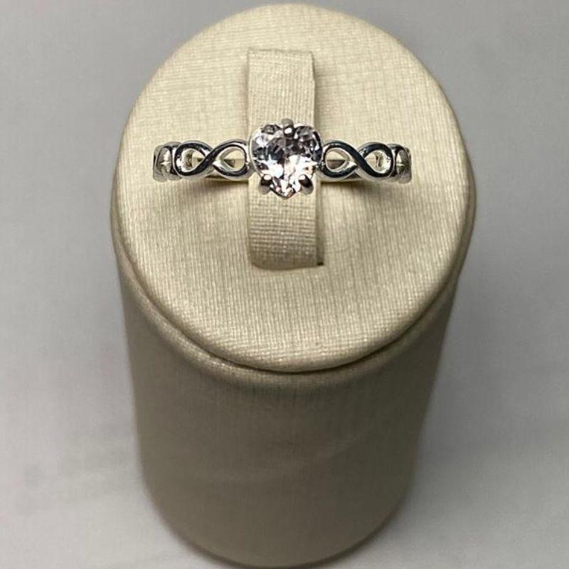 ANEL SOLITÁRIO INFINITO CORAÇÃO C/ ZIRC. 5MM CRISTAL